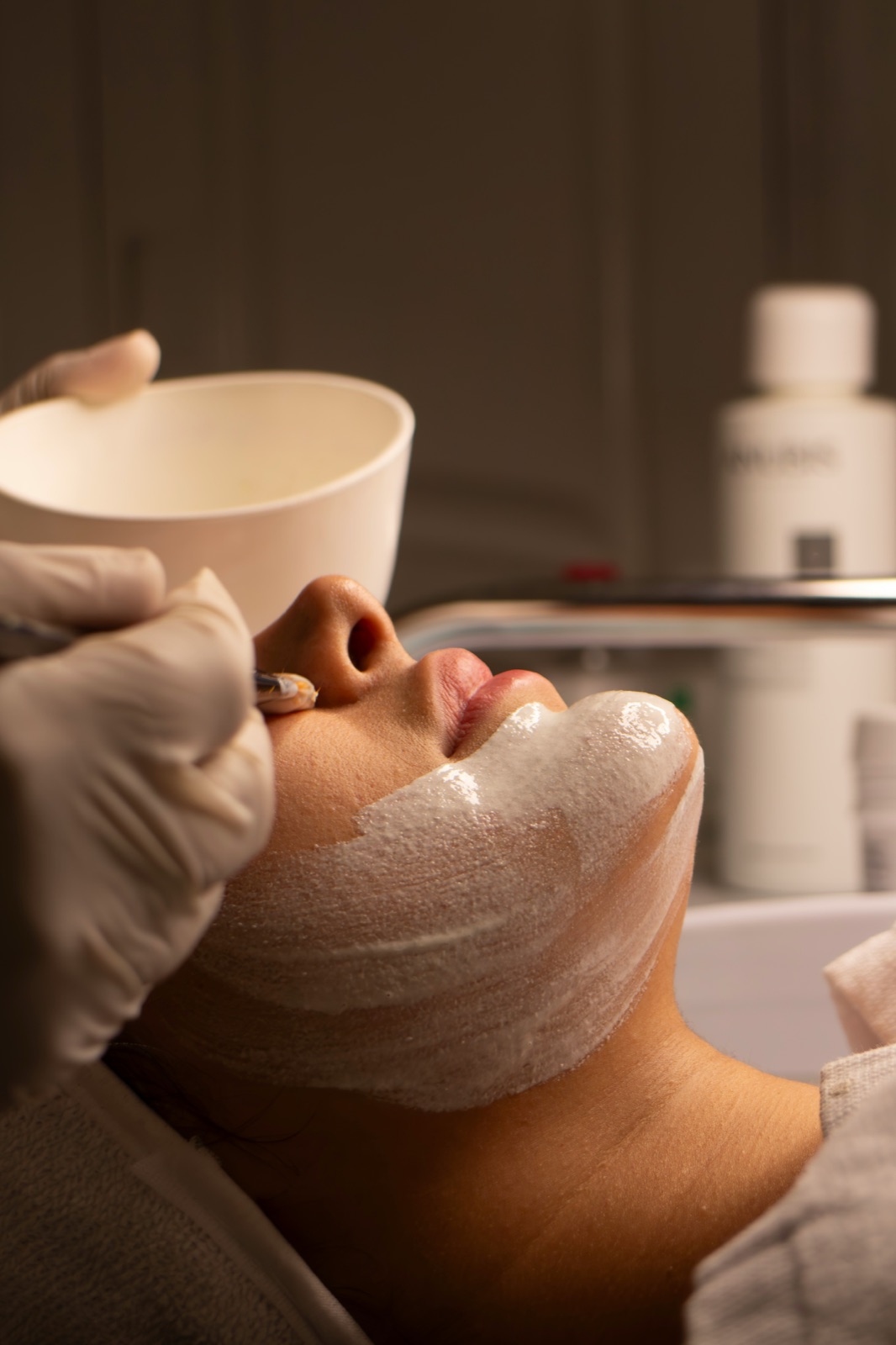 A client receiving a professional facial treatment at Solace Skin